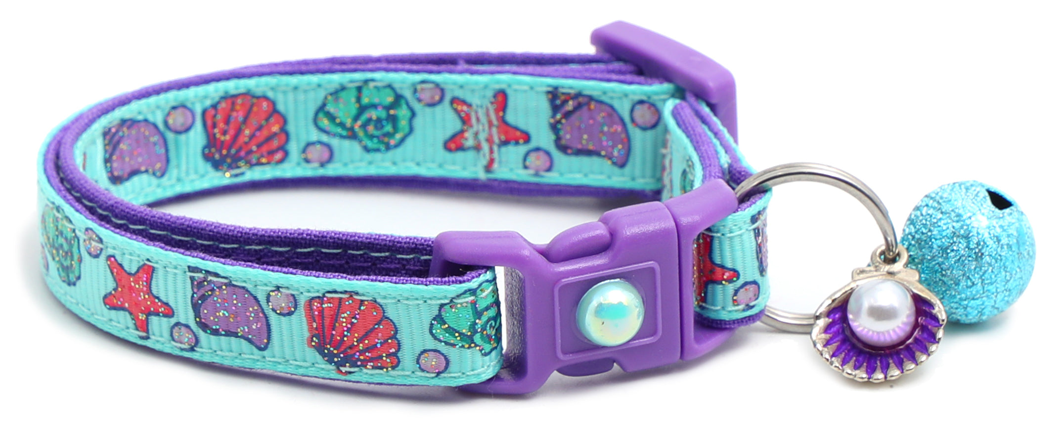 Beachcomber Breakaway Cat Collar in vibrant colors, featuring a breakaway clip and removable bell, made from soft reinforced cotton.